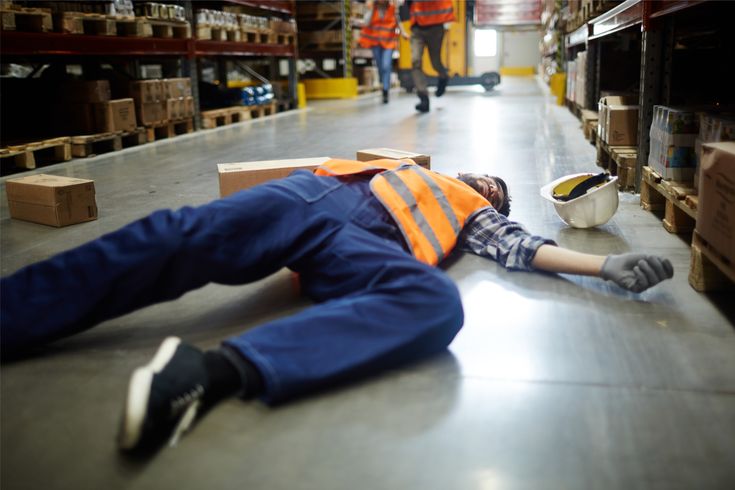 a man lying on the ground after being injured in an accident at work in london