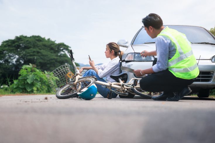 a cyclist on the ground after being injured in an accident in london