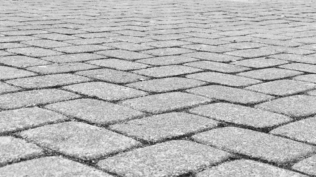 A tiled pavement made up of grey bricks