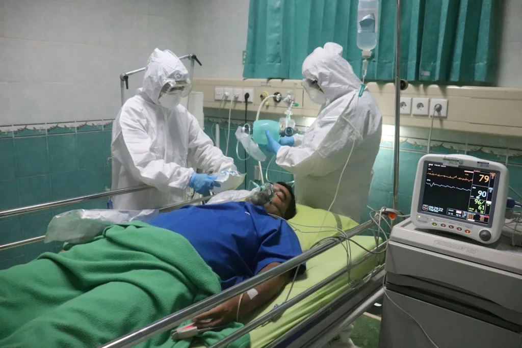 A man being operated on by surgeons in a hospital