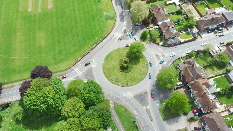 A photo of a large roundabout junction taken from above.
